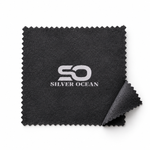 Load image into Gallery viewer, Close-up of the Silver Ocean logo on the black microfiber jewelry cleaning cloth.