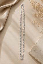 Load image into Gallery viewer, A unisex 925 Sterling Silver Figaro chain necklace displayed flat, highlighting its 5mm width and smooth links.